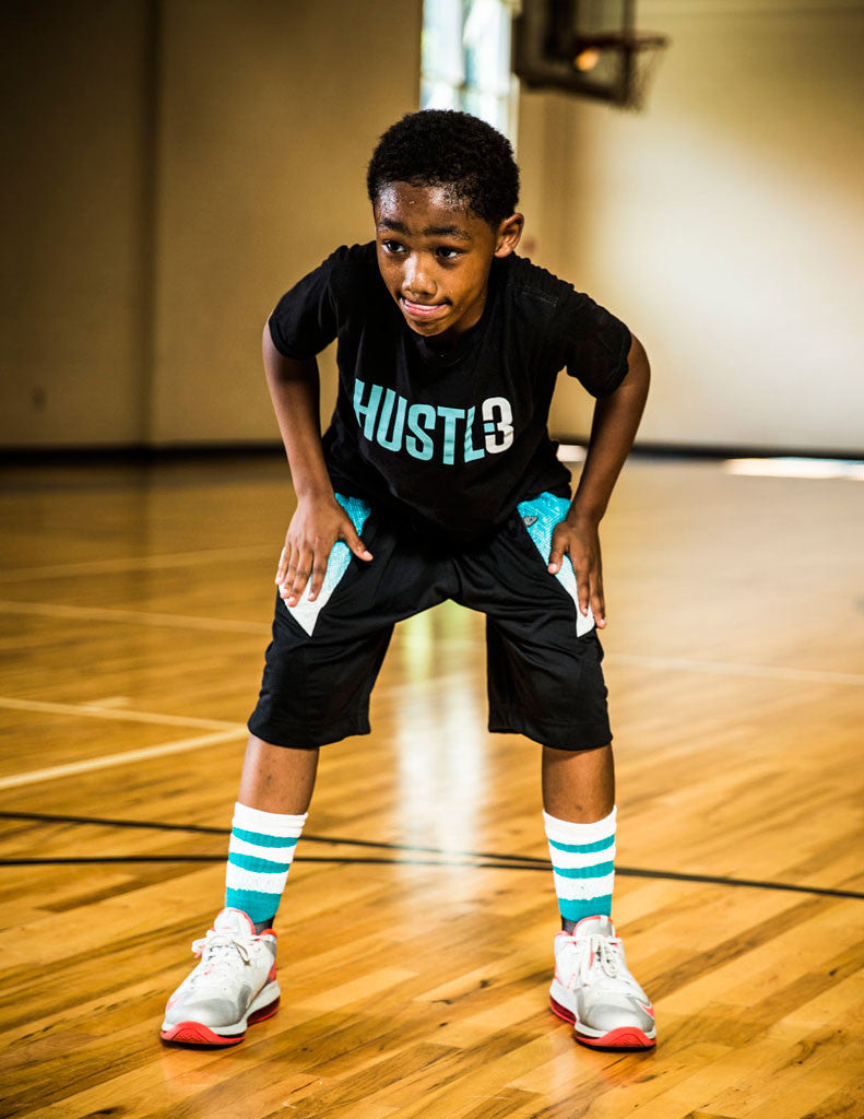 black child playing basketball